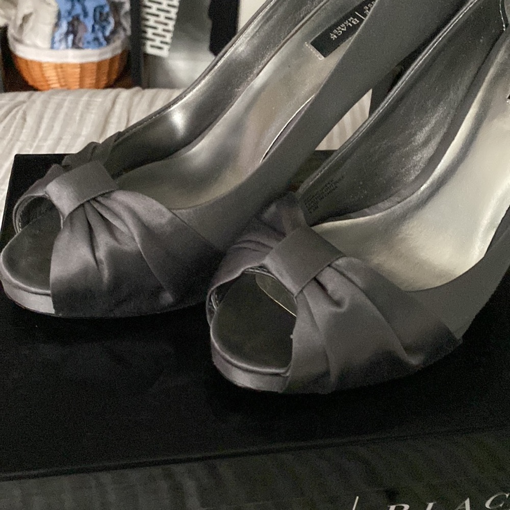Metallic silver Satin open toe high heel dress shoe. Slight platform.